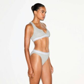 BRALETTE MED RUBBAD BOMULL MED DELAD HALSNING