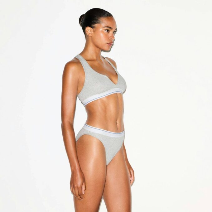 BRALETTE MED RUBBAD BOMULL MED DELAD HALSNING