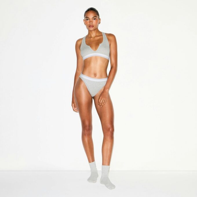 BRALETTE MED RUBBAD BOMULL MED DELAD HALSNING