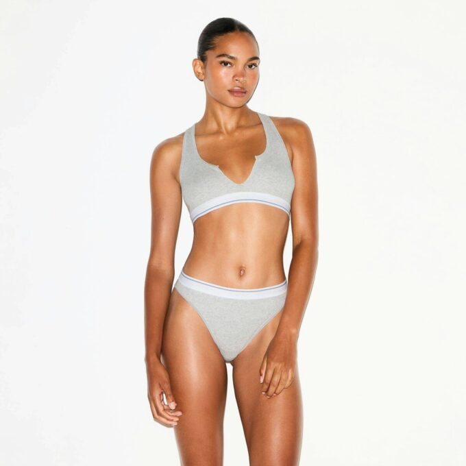 BRALETTE MED RUBBAD BOMULL MED DELAD HALSNING
